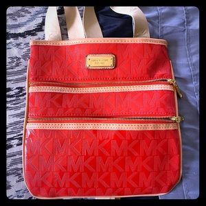 Over the shoulder Michael Kors bag.